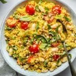 Couscous salad with cherry tomatoes and fresh basil.