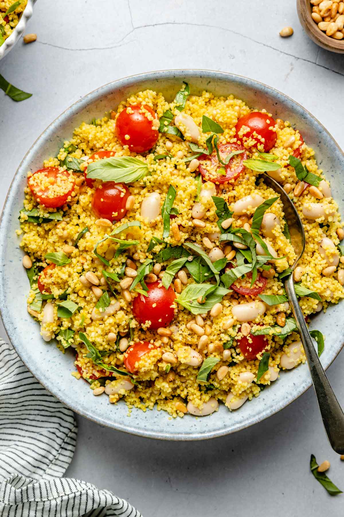 Couscous salad with cherry tomatoes and fresh basil.