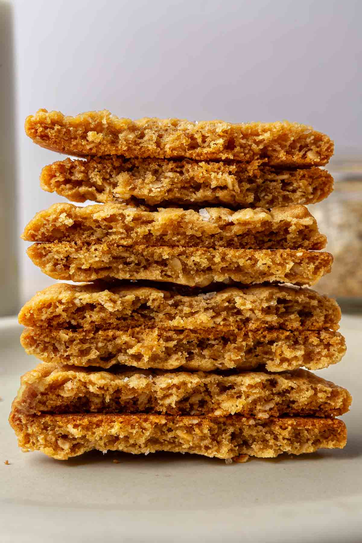 Peanut butter cookies that are cut in half and stacked.
