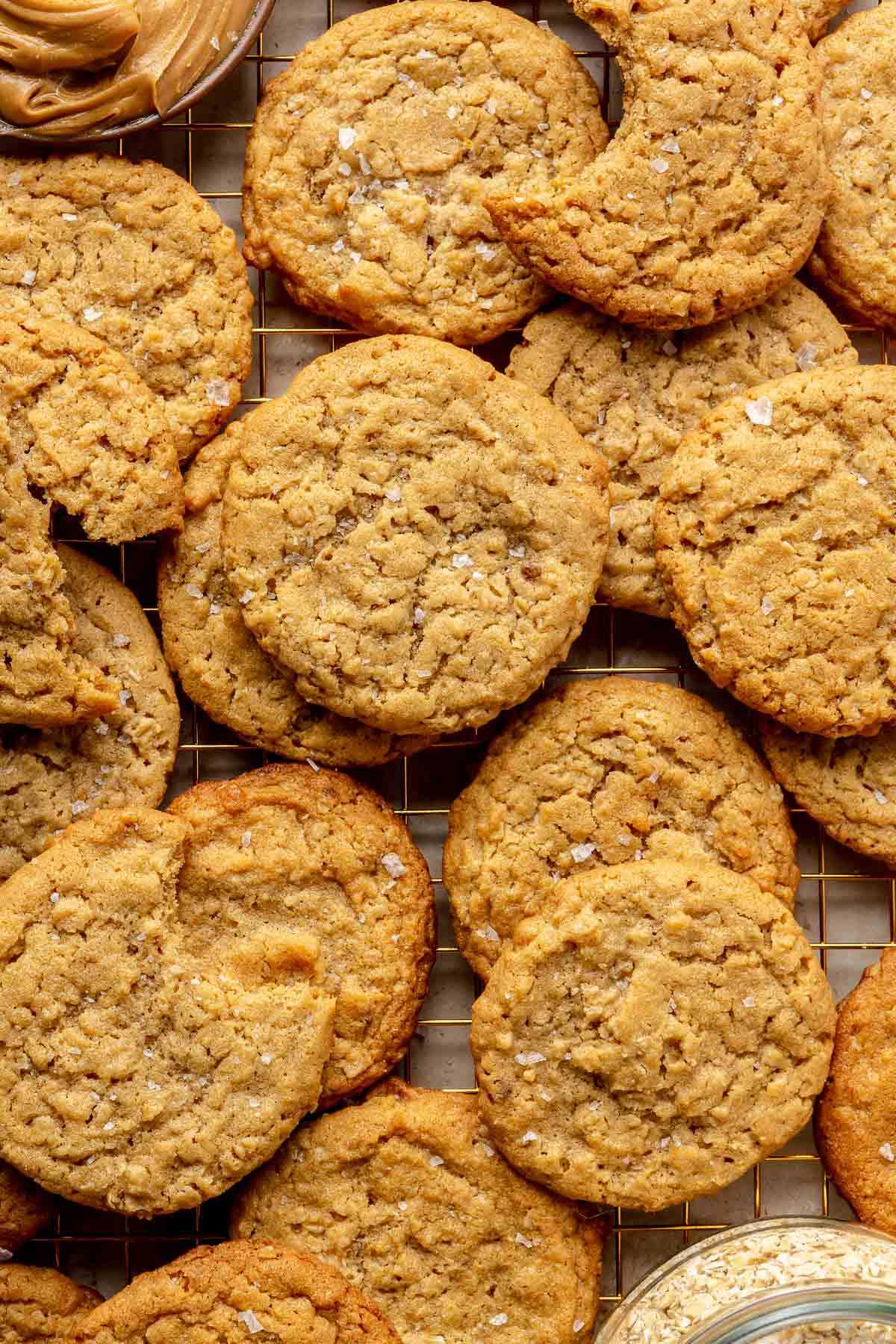 Peanut butter oatmeal cookies stacked on a parchment paper.