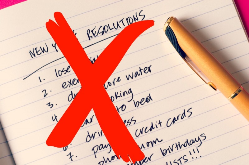 New Years resolutions list with an "X" checking an item off.