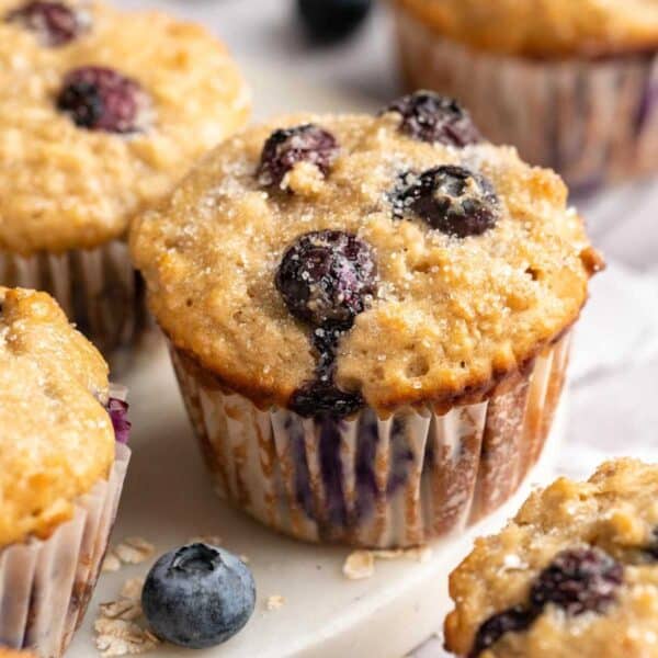 Healthy blueberry muffins topped with turbinado sugar.
