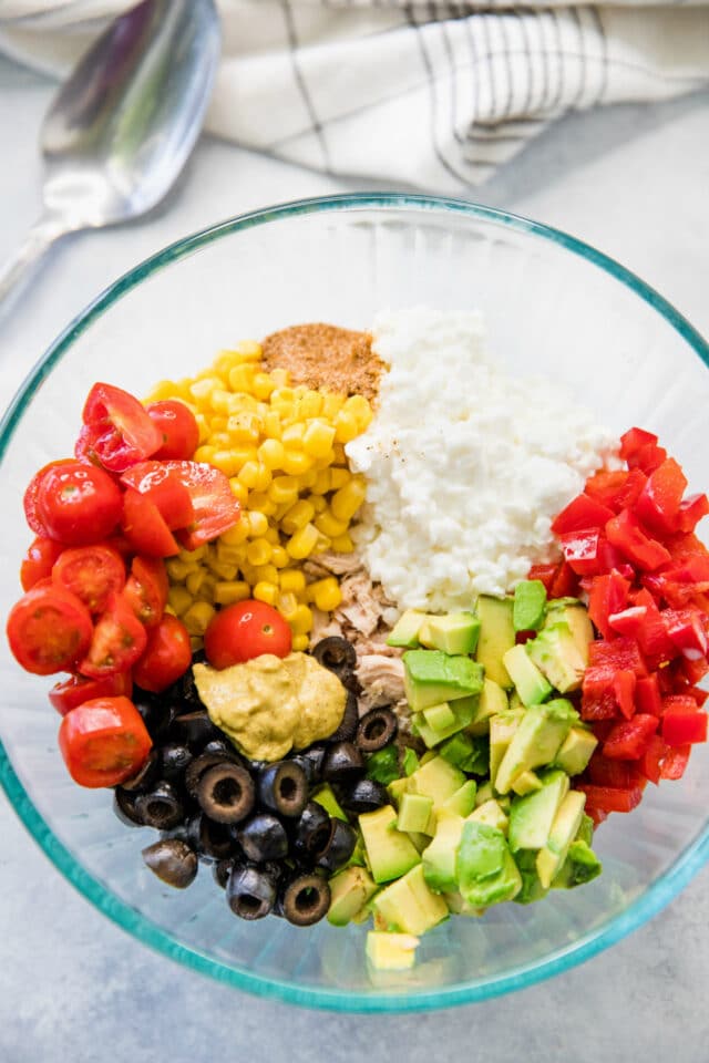 all cottage cheese tuna salad ingredients in a glass mixing bowl