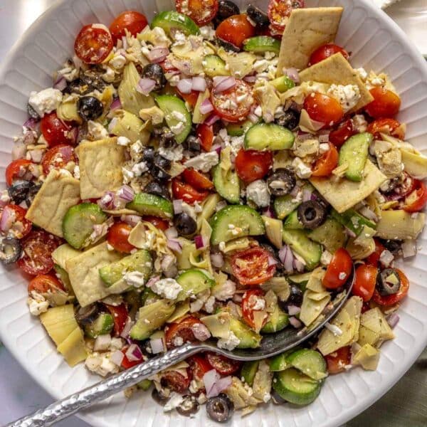 Greek salad served with pita chips.