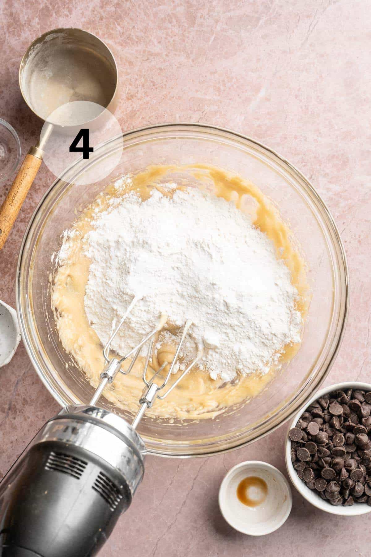 Beating flour into cookie dough.