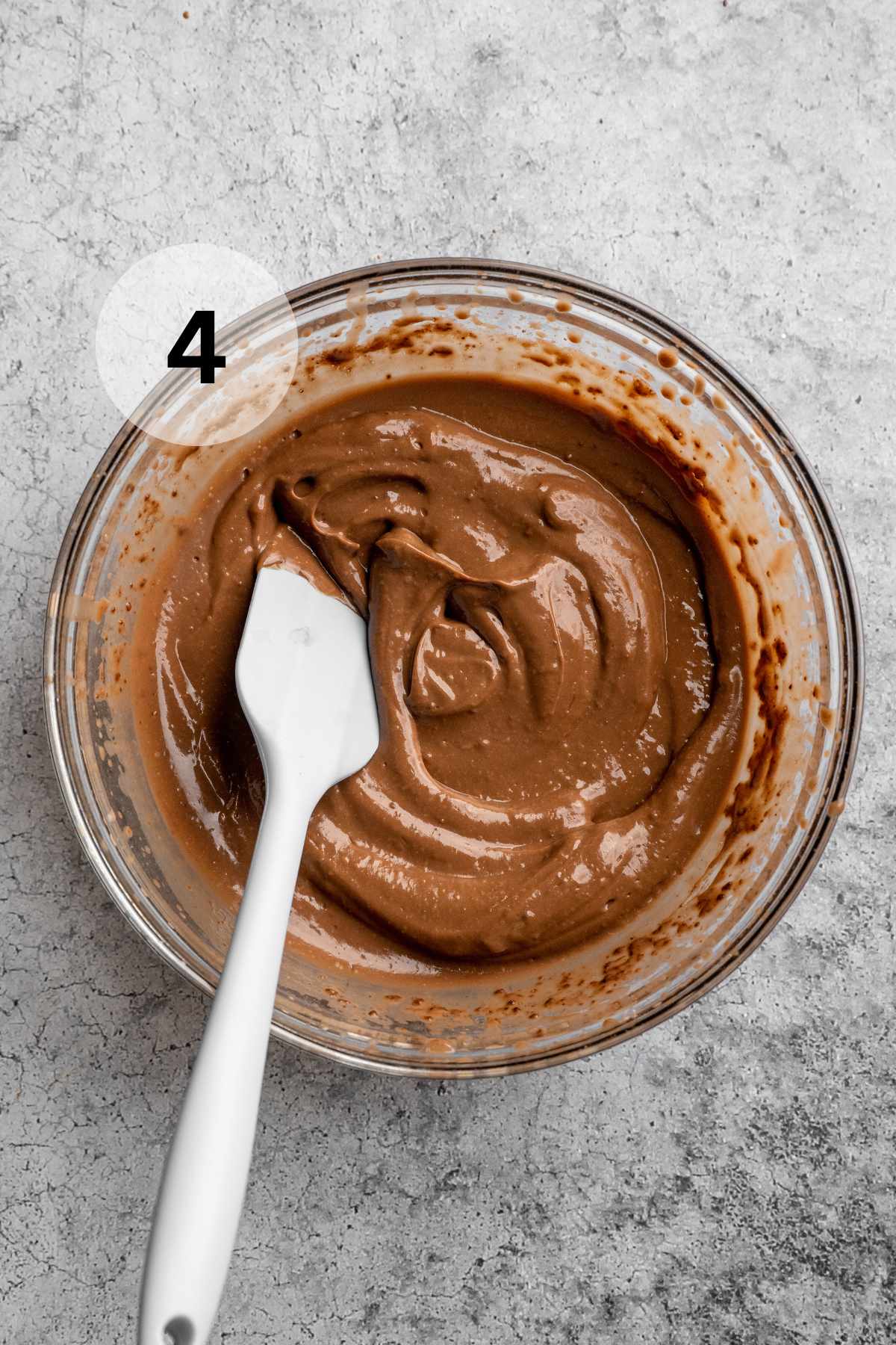 Mixing chocolate pudding in a large bowl.