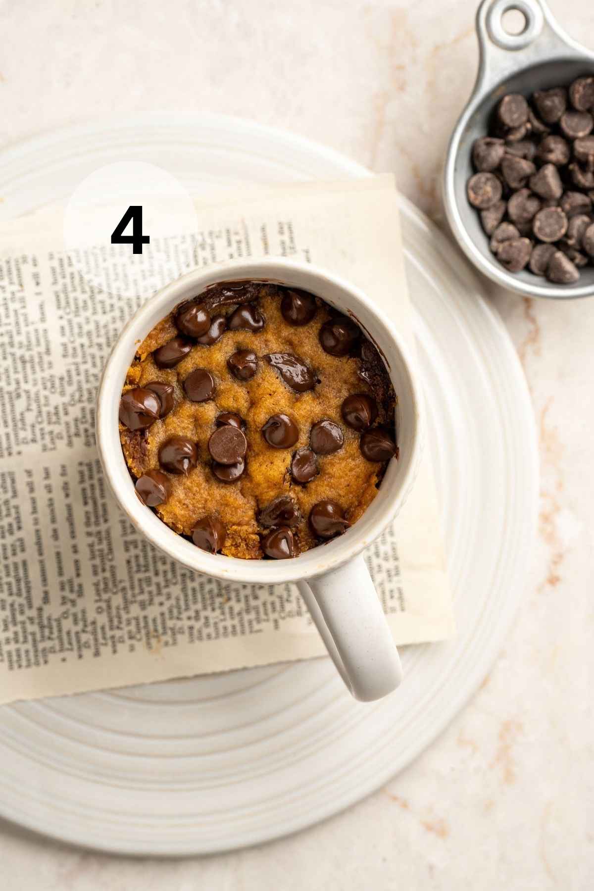 Pumpkin mug cake topped with chocolate chips.