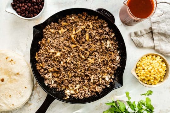 Browning ground beef in a large skillet.
