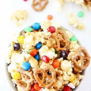 Popcorn with M&M's and pretzels in a bowl.