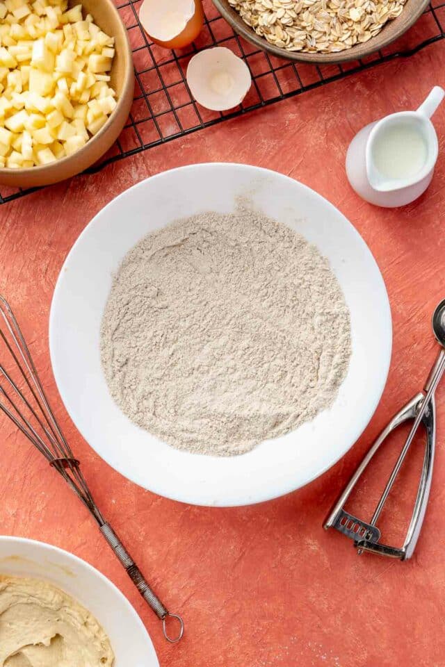 Whisking flour, baking soda and spices.
