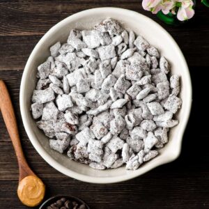 Puppy chow recipe in a white bowl.