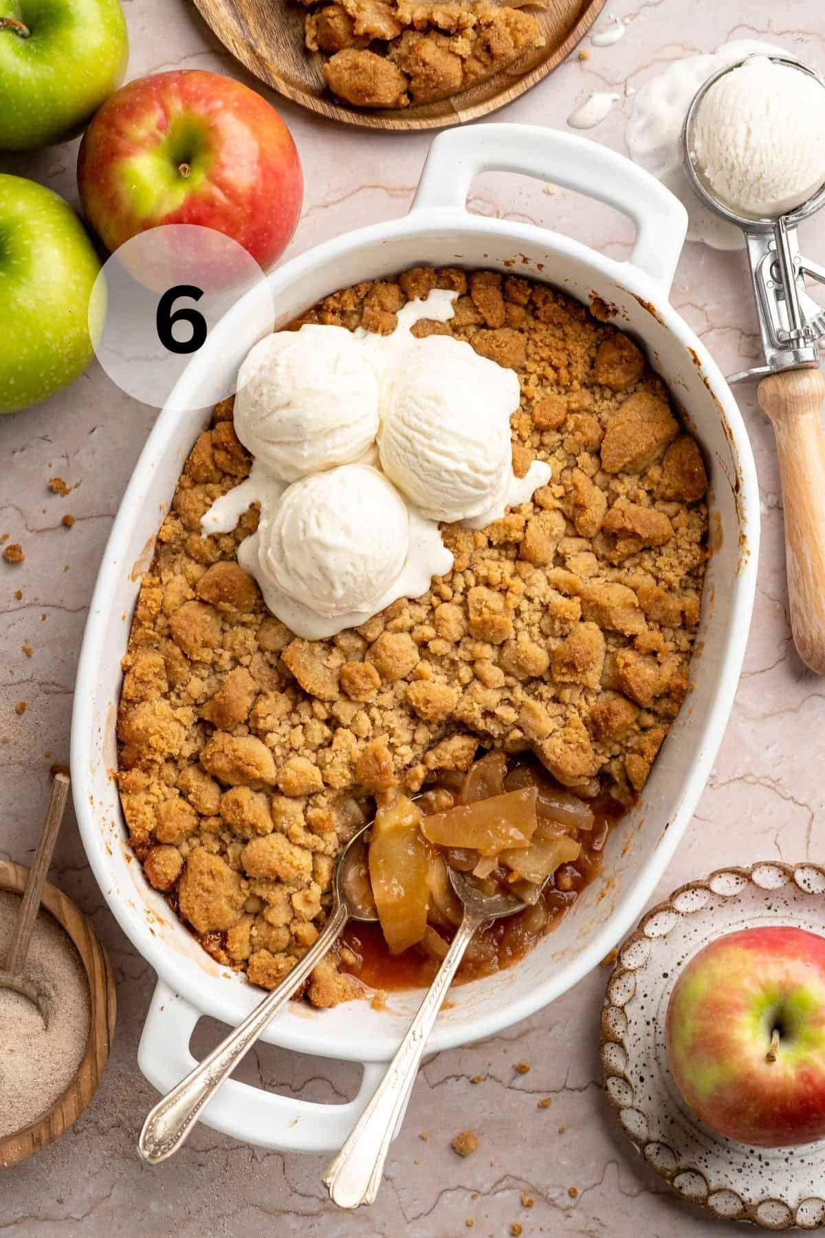 Apple crumble topped with vanilla ice cream.