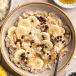 Egg white oatmeal topped with banana slices and mini chocolate chips.