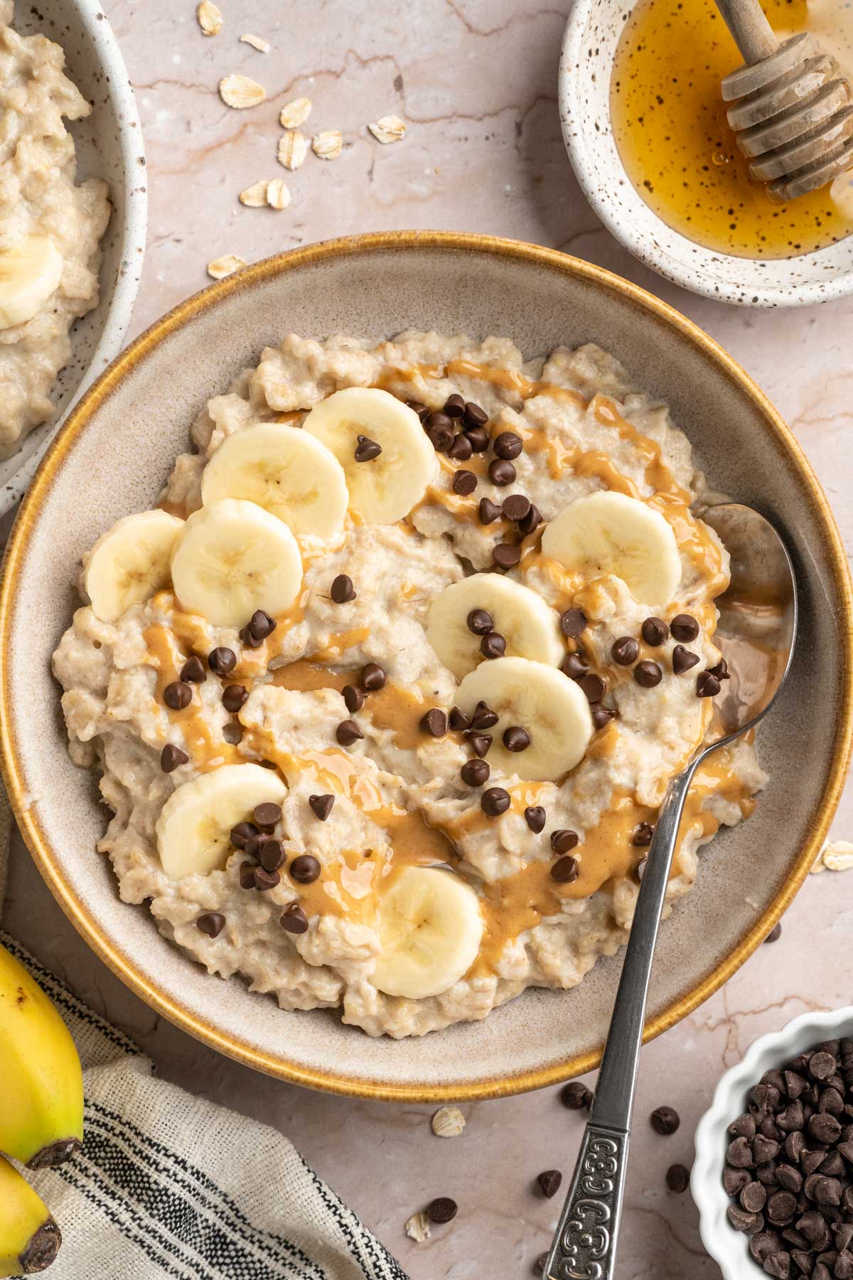 Egg white oatmeal topped with banana slices and mini chocolate chips.