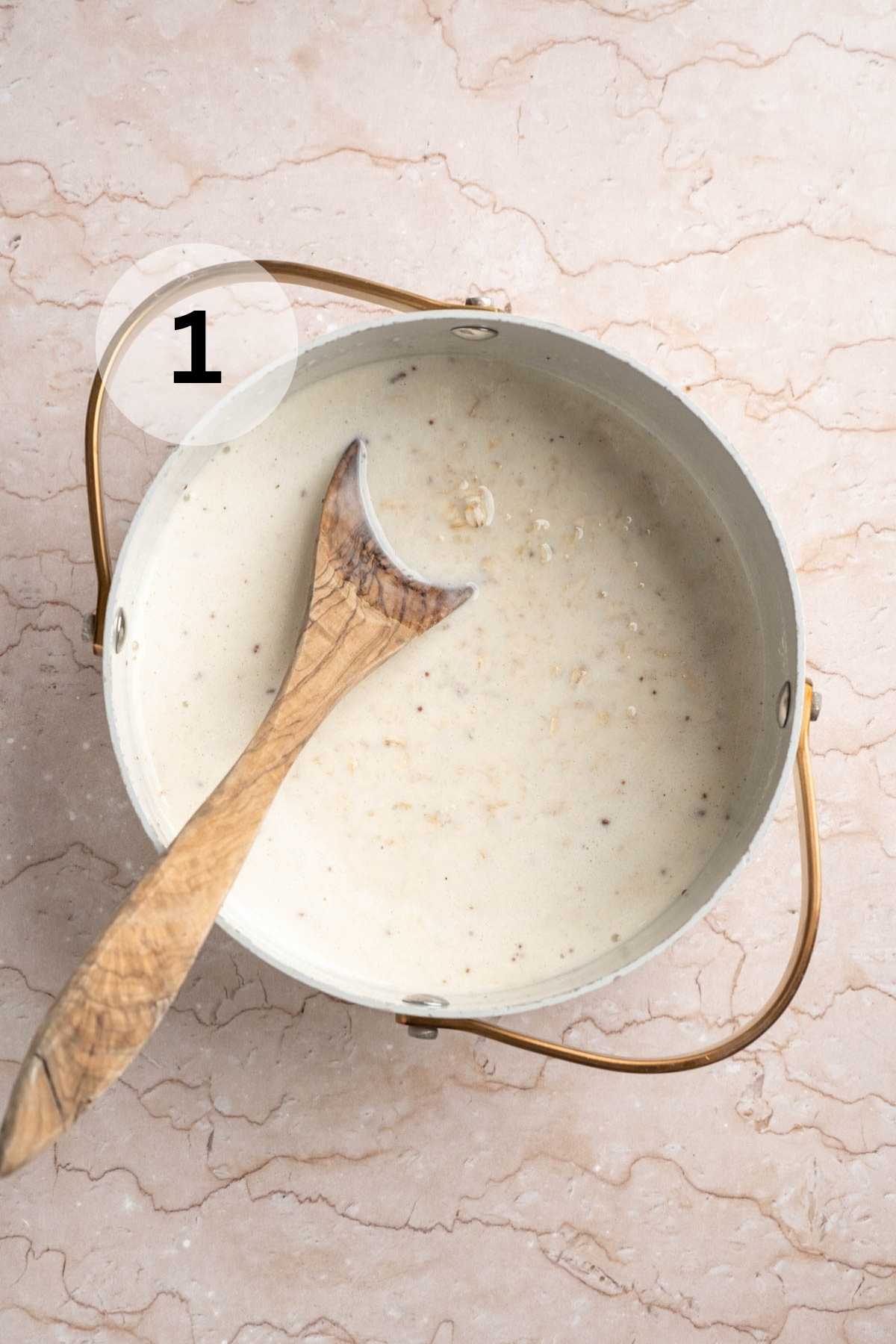 Stirring oats, banana, milk, and salt in a small saucepan.