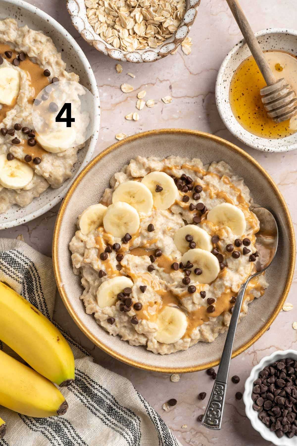 Egg white oatmeal topped with banana slices, a drizzle of peanut butter and mini chocolate chips.