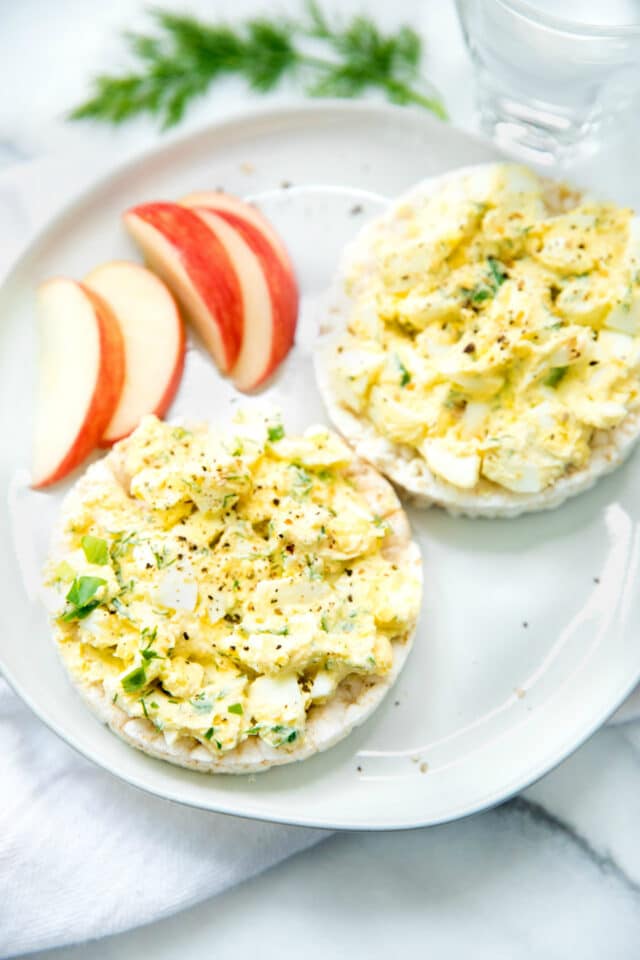 Egg Salad on a rice cakes served with an apple