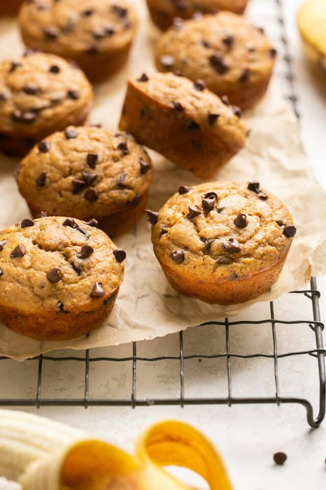 Pancake mix muffins with chocolate chips on a wire cooling rack.