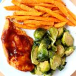 A quick, tasty, balanced meal is exactly what I'm after and this easy skillet BBQ chicken with Brussels sprouts and sweet potato fries is the perfect fix. The meal comes together in less than 30 minutes, it has tons of flavor and takes very little prep.