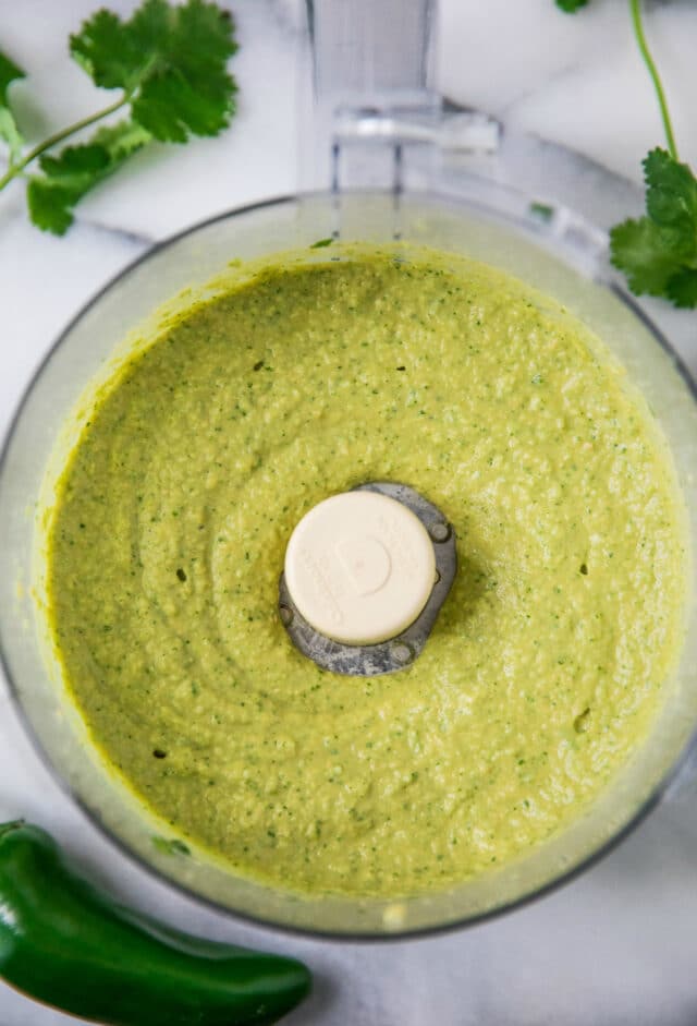 Cilantro Jalapeño Hummus mixed in the bowl of a food processor