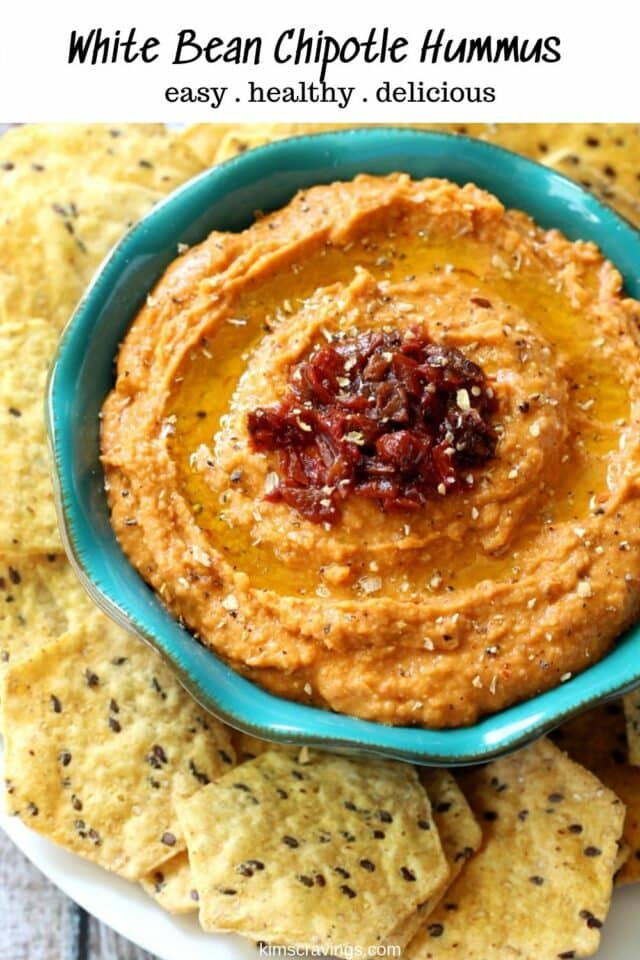white bean hummus topped with chopped chipotle peppers served with chips