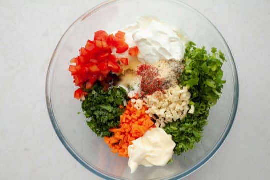 All ingredients for yogurt dip mixed in a large bowl.