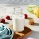 Greek yogurt ranch dressing near fresh veggies.