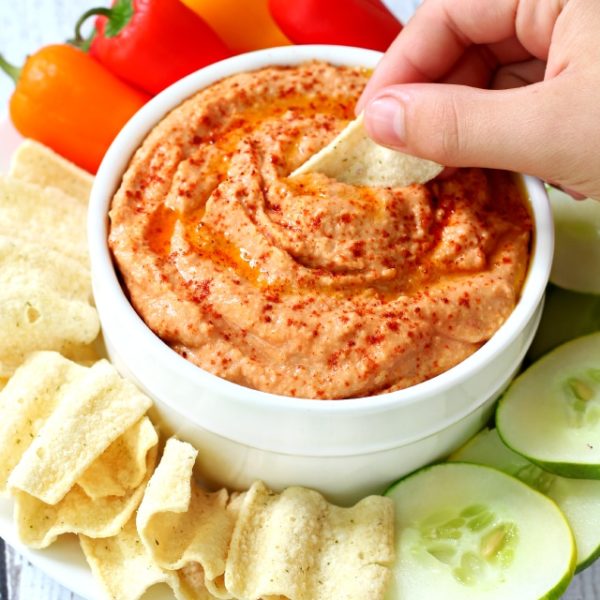 Roasted Tomato Hummus- a creamy, delicious, mild tasting hummus with flavors of summer. Dip it, spread it on sandwiches or use it as a salad topping.