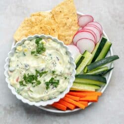 Mexican cottage cheese dip served with freshly cut veggies and tortilla chips.