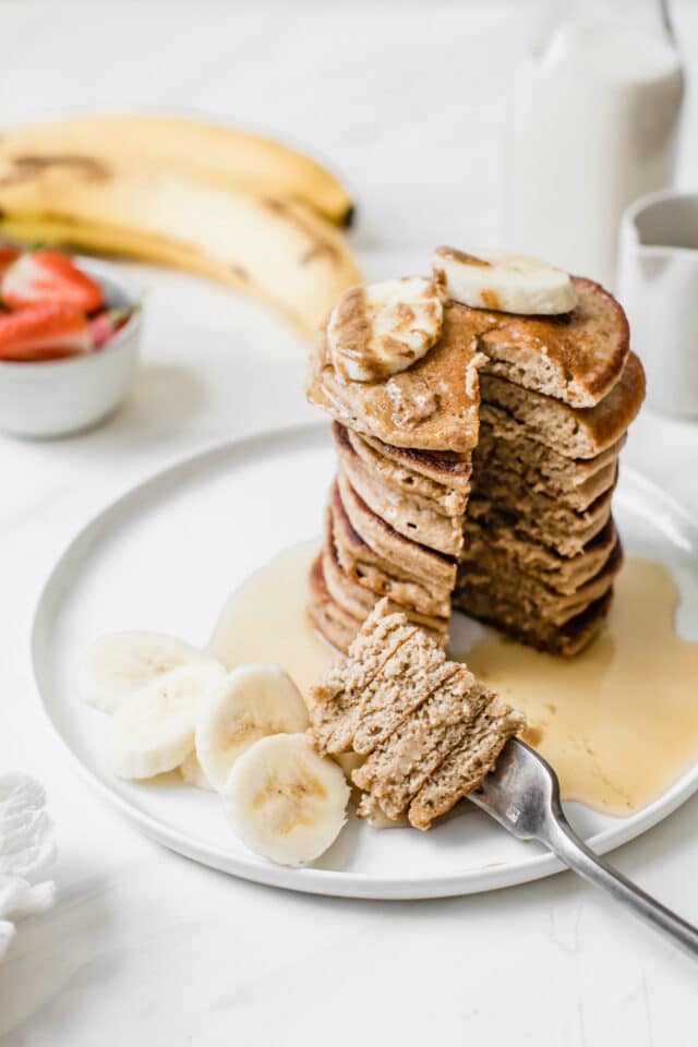 banana oat pancakes with a bite on a fork