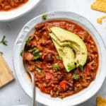 bison chili topped with avocado and fresh cilantro