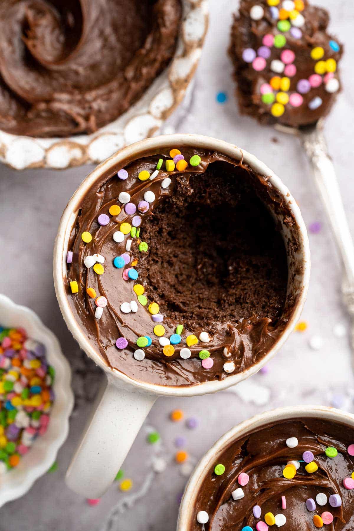 Protein mug cake that has a spoonful taken out.