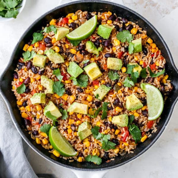 Mexican brown rice in a large white skillet