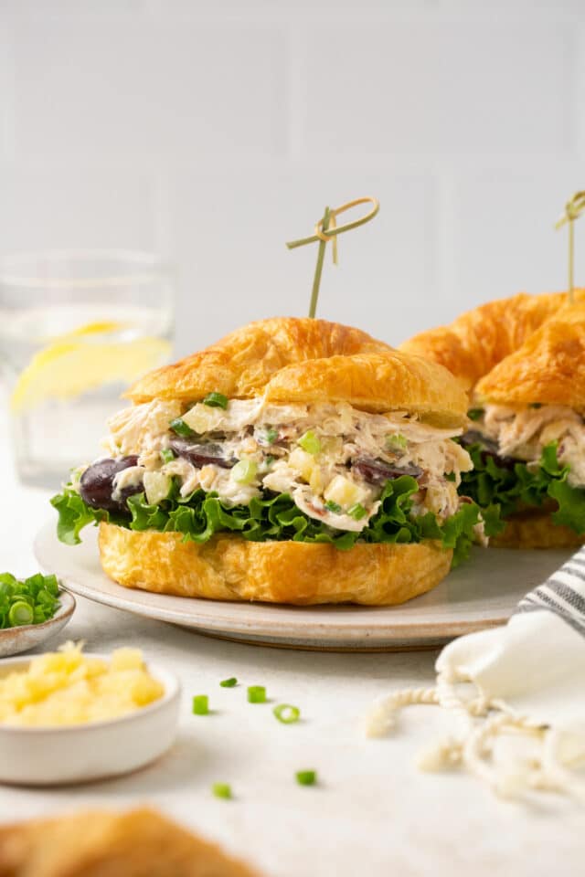 Sandwich made with a croissant and pineapple chicken salad.