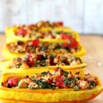 Roasted delicata squash brimming with lean turkey, nutritious spinach and juicy tomatoes makes for an incredibly delicious fall meal- this super simple stuffed delicata squash is a must try! (gluten-free & Paleo)