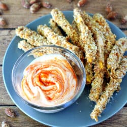 Almond Crusted Sweet Potato Fries dipped in Creamy Sriracha Sauce- the absolute perfect game-day appetizer for the health conscious!