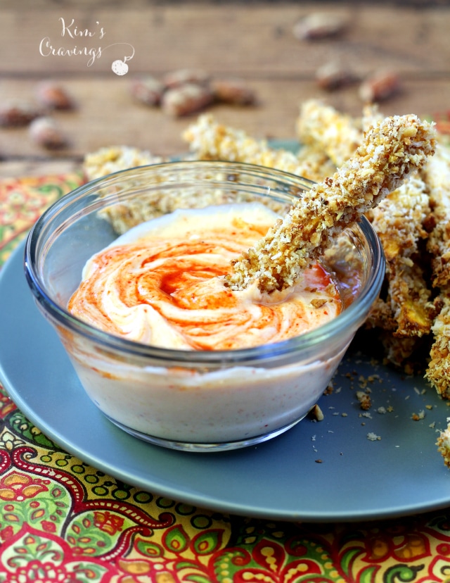 Almond Crusted Sweet Potato Fries dipped in Creamy Sriracha Sauce- the absolute perfect game-day appetizer for the health conscious!