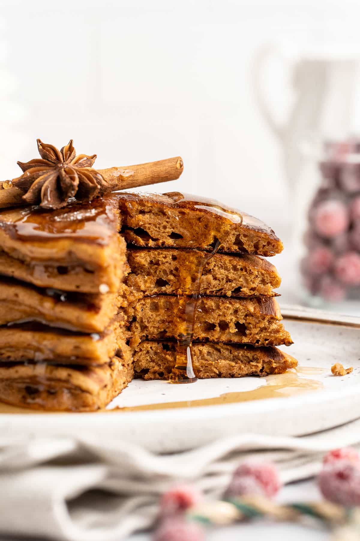 Stack of gingerbread pancakes that have been cut into.