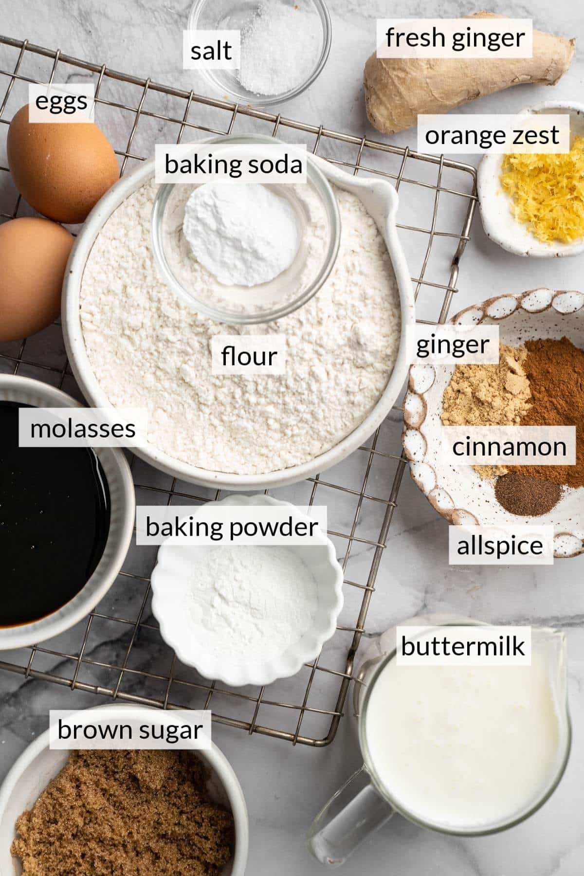 Small bowls with flour, eggs, brown sugar, spices and buttermilk.