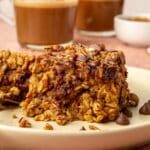 Pumpkin baked oatmeal on a plate with chocolate chips.