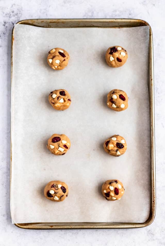 balls of cookie dough on a cookie sheet
