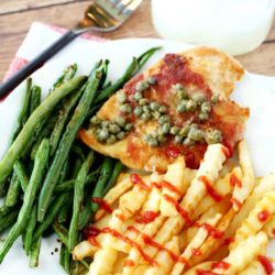Prosciutto-Wrapped Chicken is a quick, yet flavor-packed recipe topped with an easy and yummy lemon caper pan sauce. Served with my favorite Alexia Crinkle Cut Fries and roasted green beans, this family-friendly meal comes together in less than 30 minutes.