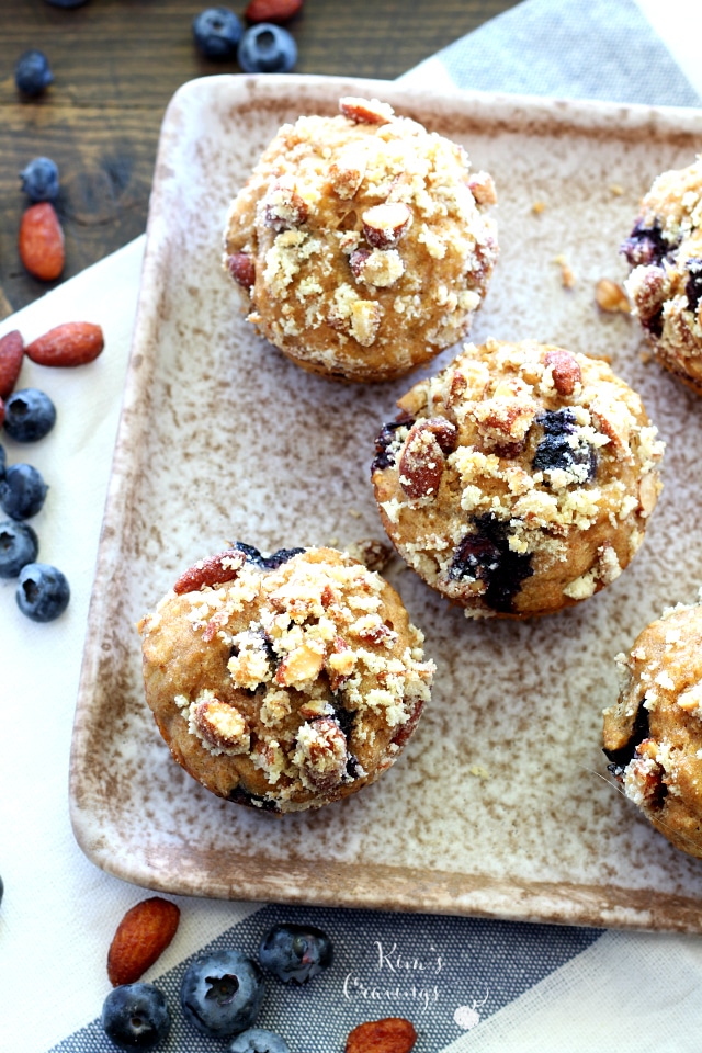 Whole grain blueberry banana muffins filled with plump juicy blueberries and covered with a sweet almond streusel topping! These muffins are a MUST make and so perfect for Easter brunch!