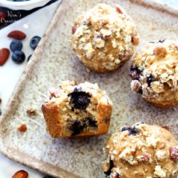 Whole grain blueberry banana muffins on a plate