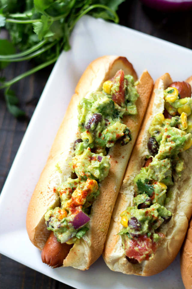 Southwestern Guacamole Hot Dogs- grilled Hebrew National Hot Dogs topped with flavorful Southwestern Guacamole. This one's a major crowd-pleaser!