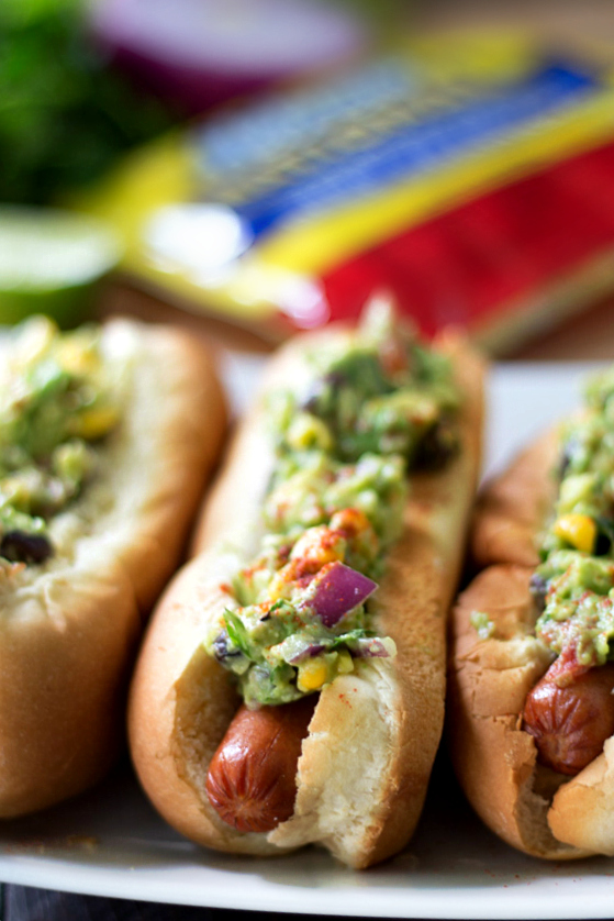 Southwestern Guacamole Hot Dogs- grilled Hebrew National Hot Dogs topped with flavorful Southwestern Guacamole. This one's a major crowd-pleaser!