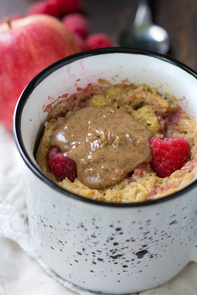 If you're looking for a delicious, easy, mess-free morning meal, you're going to love this recipe for Raspberry Apple Microwave Baked Oatmeal in a Mug.
