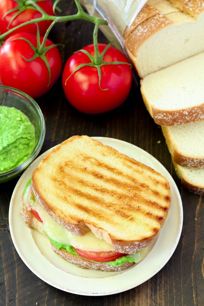 Celebrate National Grilled Cheese Day in the most delicious way possible- with an irresistible Caprese Grilled Cheese with Pesto!
