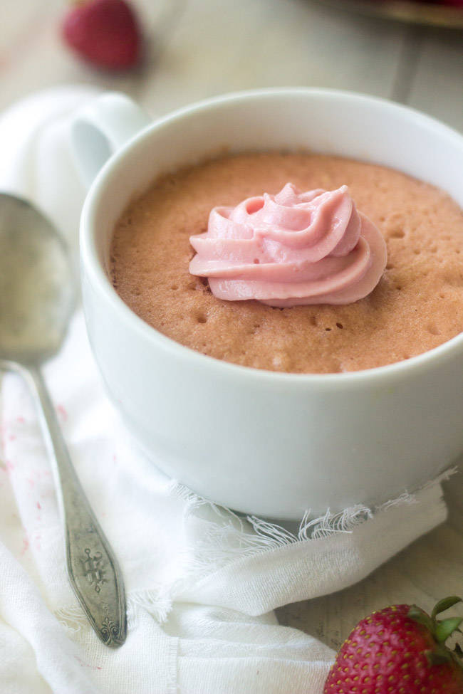 This easy Strawberry Mug Cake Recipe comes together in two minutes and is healthy, whole wheat, protein packed and SO fluffy!
