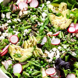 Salad with asparagus, peas, radishes and avocado.